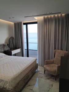 Ένα ή περισσότερα κρεβάτια σε δωμάτιο στο IDeal Sea View Apartment