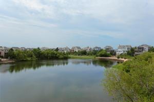 a view of a river with houses and condos at Cloudless Day in Nags Head