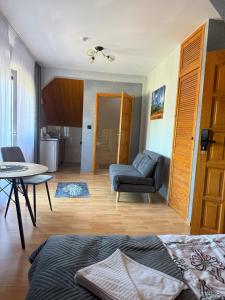 a living room with a couch and a table at Kowali Wierch - blisko Centrum i Dworca PKP in Zakopane +82 photos