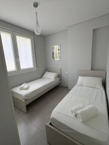 Postel nebo postele na pokoji v ubytování Sea Villa Pandora