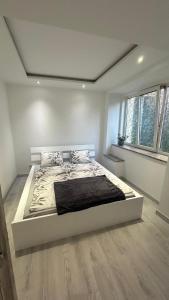 a bedroom with a large bed in a room at Apartament Nad Potokiem in Mieroszów
