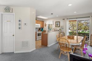 a kitchen and dining room with a table and chairs at Corolla & Lime in Corolla +78 photos