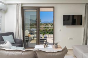a living room with a couch and a table at Maera Apartments in Sami