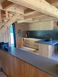 a kitchen with a counter with a sink in it at La Torre d' Espinalbet in Castellar del Riu