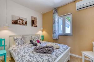 a bedroom with a bed and a window at Holiday home in Hreljin 39447 in Hreljin +42 photos
