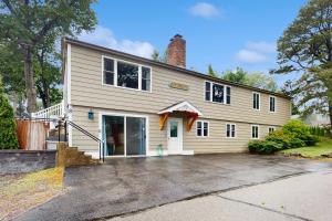 a white house with a garage at Birch Circle Beach House in Ogunquit