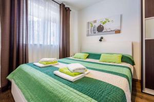 En eller flere senge i et værelse på Holiday home in Grizane 39291 + 31 billeder