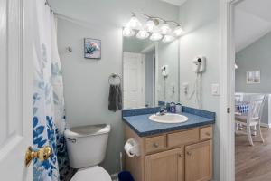 a bathroom with a sink and a toilet at Dream23 in Corolla