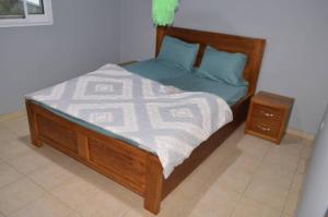Postel nebo postele na pokoji v ubytování ACNELA Residence Kribi