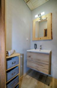 a bathroom with a sink and a mirror at Pension Klose in Kubova Huť