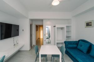 Телевизор и/или развлекательный центр в Fidopo Houses