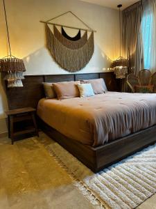 a bedroom with a large bed in a room at Villa with a private pool in Tulum