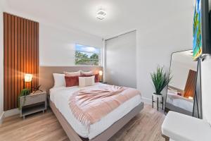 a bedroom with a large bed and a mirror at Miami house Heated Pool Game Room BBQ L67 in Lindgren Acres +28 photos