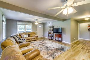a living room with a couch and a tv at 2 Mi to Shops and Eats Family Home in Donalsonville in Donalsonville