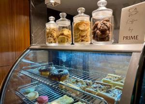 a display case with many different pastries in jars at The Prime Delhi in New Delhi +26 photos