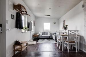 a living room with a couch and a table at Udden in Karlskoga