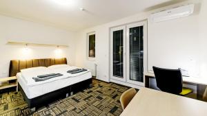 Ένα ή περισσότερα κρεβάτια σε δωμάτιο στο eFi Palace Hotel