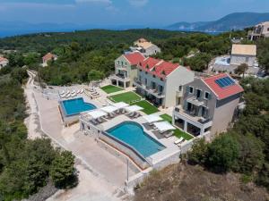 an aerial view of a house with a swimming pool at THISEFS luxury apartments Kefalonia in Antipata