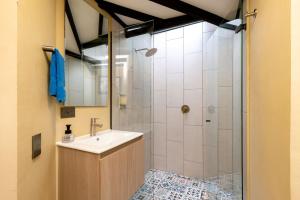 a bathroom with a sink and a shower at L3 9BR Laureles House Rooftop 2 Jacuzzis AC in Medellín +88 photos