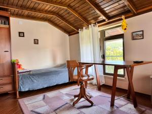 a dining room with a table and a bed at Къща за гости Заркови in Gaber +47 photos