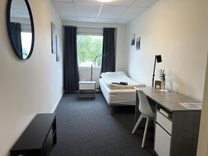 Giường trong phòng chung tại Rentalux Hostel - Modern Comfort, Single Rooms