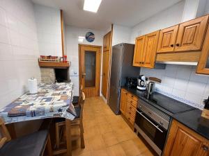 A kitchen or kitchenette at Casa Bellavista con piscina en Caldes Costa Brava