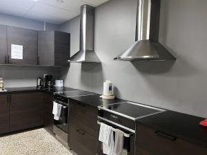 Nhà bếp/bếp nhỏ tại Rentalux Hostel - Modern Comfort, Single Rooms