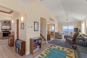 a living room with a view of the ocean at Everlasting Moon in Rodanthe