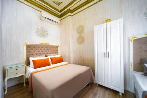Postel nebo postele na pokoji v ubytování Alhambra Apart Hotel