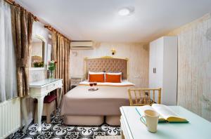 Postel nebo postele na pokoji v ubytování Alhambra Apart Hotel