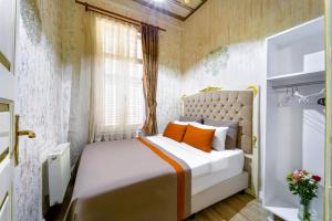 Postel nebo postele na pokoji v ubytování Alhambra Apart Hotel