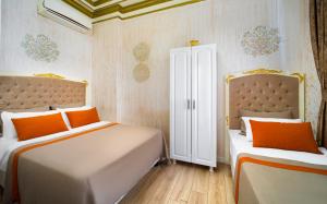 Postel nebo postele na pokoji v ubytování Alhambra Apart Hotel