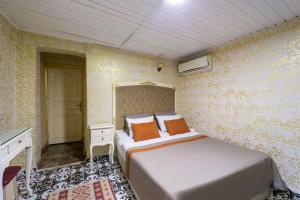 Postel nebo postele na pokoji v ubytování Alhambra Apart Hotel