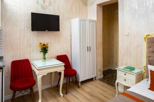 TV a/nebo společenská místnost v ubytování Alhambra Apart Hotel