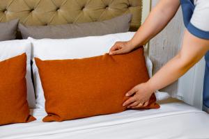 Postel nebo postele na pokoji v ubytování Alhambra Apart Hotel