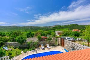 a villa with a view of the mountains at Holiday home in Drivenik 39517 in Drivenik