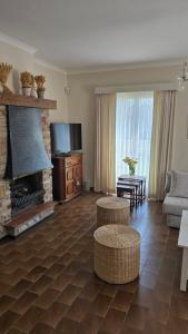 a living room with a couch and a fireplace at Sea Home in Middelkerke