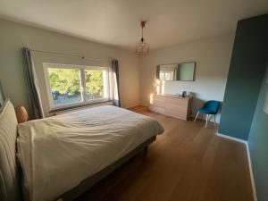 Ένα ή περισσότερα κρεβάτια σε δωμάτιο στο Villa Romy - à 2 pas du circuit de Spa-Francorchamps