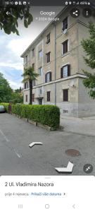 una foto de un edificio con un cartel delante en Sea view apartment Matulji, en Matulji