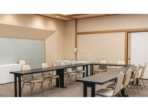 a conference room with tables and chairs and a chalkboard at Ouka no sato La-Foret Shobara - Vacation STAY 49255v in Shōbara +79 photos