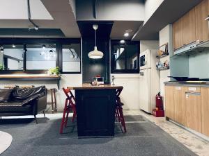 Kuchyň nebo kuchyňský kout v ubytování 拉開門輕旅 Le Passage Hostel + 32 fotografií