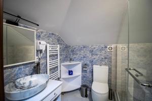 a bathroom with a sink and a toilet at Green Garden Guesthouse in Tbilisi City