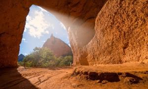 a cave with a view of a mountain in the background at Casa Divina in Lago de Carucedo