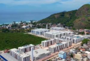 an aerial view of a city with white buildings at Quarto para mulheres em Cond Orla Recreio Prainha in Rio de Janeiro +3 photos