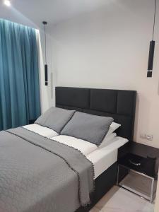 Posteľ alebo postele v izbe v ubytovaní Apartament Przystań z tarasem