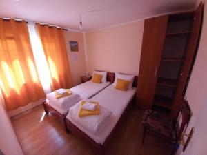 Letto o letti in una camera di Apartmani Sobe Sljivancanin