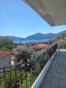 a balcony with a view of the water at galazio in Khorió Akhíllion
