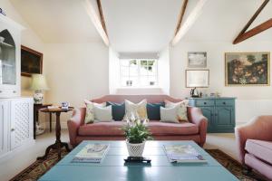 a living room with a couch and a table at Trewardale in Bodmin