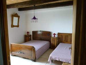 Postel nebo postele na pokoji v ubytování Gîte à la ferme