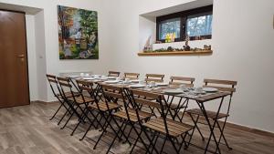 a table in a room with chairs around it at Casale Trifoglio in Morano Calabro